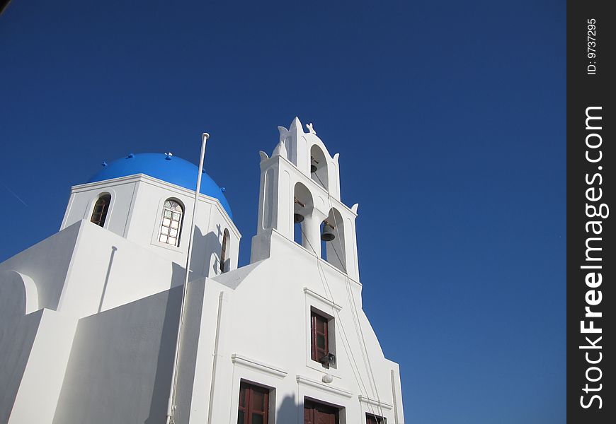 Oia church in greece closes to the blue sky