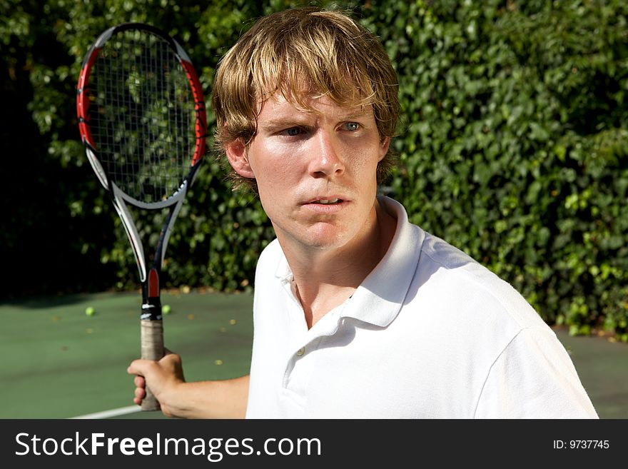 An up close shot of a tennis player ready to hit a forehand back. An up close shot of a tennis player ready to hit a forehand back