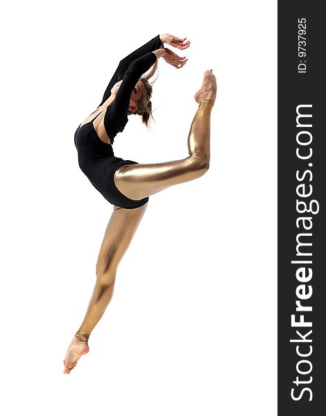 Modern style dancer jumping on studio background