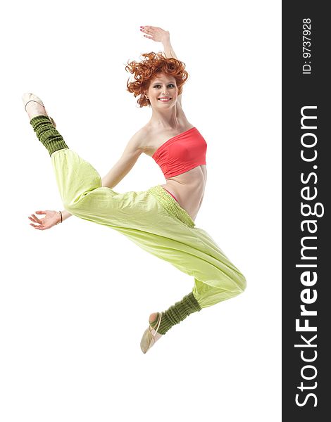 Modern style dancer jumping on studio background