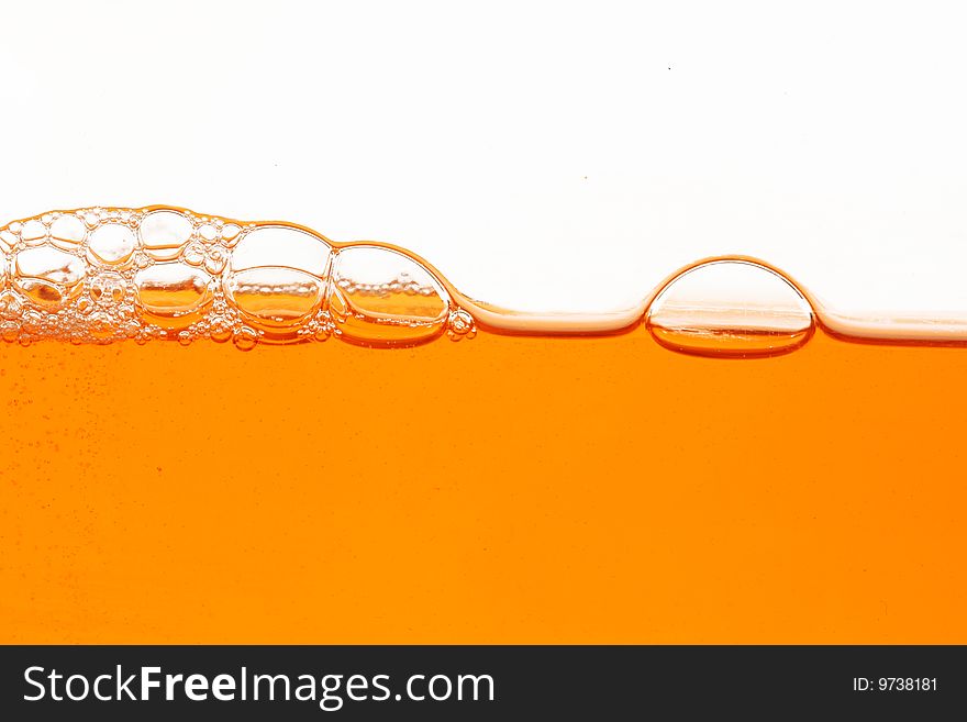 Macro of orange soap bubbles isolated. Macro of orange soap bubbles isolated