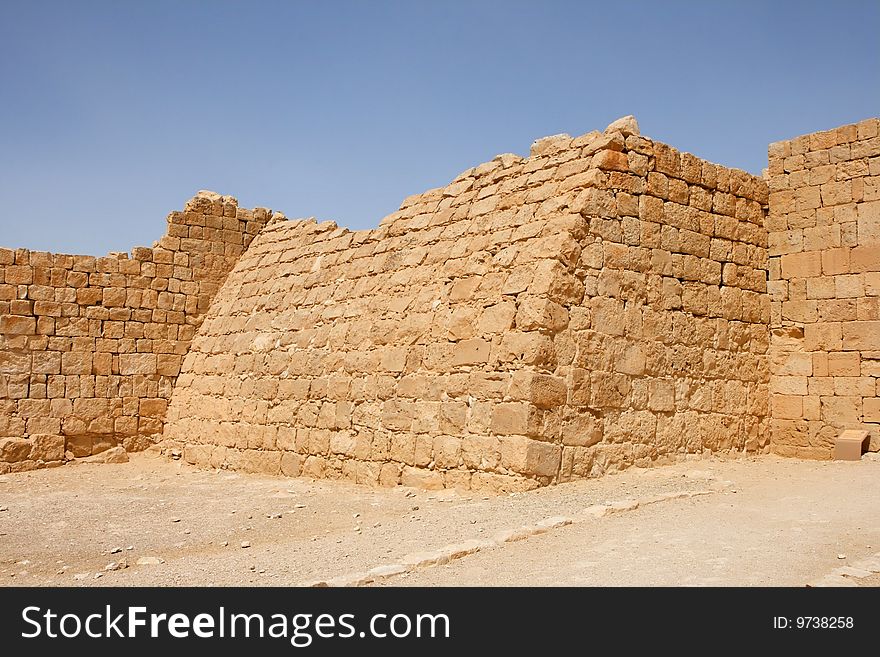 Ruins of the curved wall of ancient fortress in Ovdat, Israel