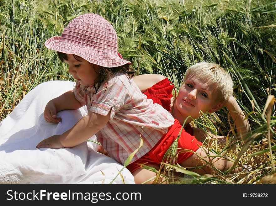 Mother And Daughter In Green Field