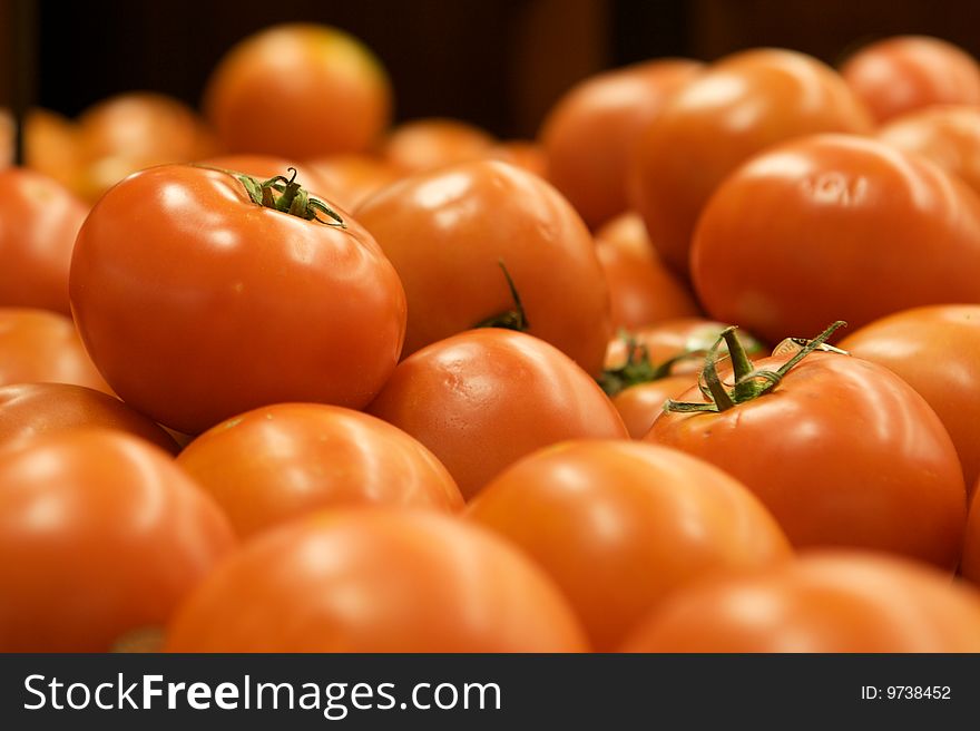 Group of Tomatoes shiny and red  with stems