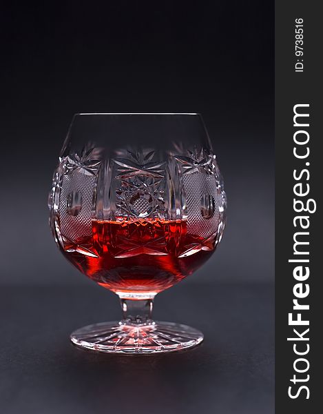 Glass Of Strong Alcohol On Black Background