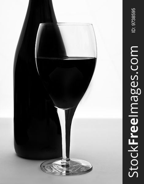 Black and white bottle and glass of wine. Black and white bottle and glass of wine