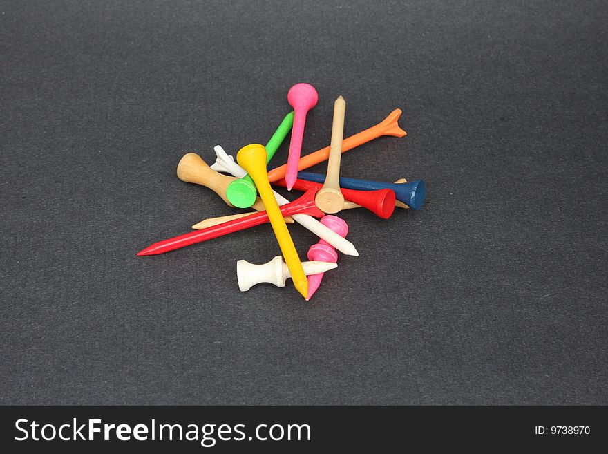 Assorted golf tees in a small pile.