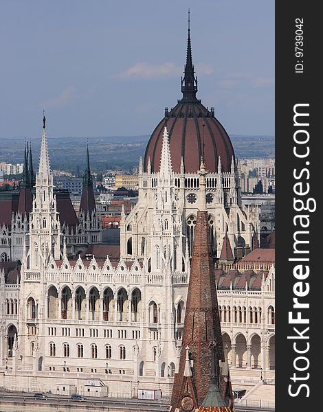 The Hungarian Parliament Building is the seat of the National Assembly of Hungary, one of Europe's oldest legislative buildings, a notable landmark of Hungary and a popular tourist destination of Budapest. It lies in Kossuth Lajos Square, on the bank of the Danube, in Budapest. It is currently the largest building in Hungary, and the second largest Parliament in Europe. Construction from the winning plan was started in 1885 and the building was inaugurated on the 1000th anniversary of the country in 1896, and completed in 1904. (The architect of the building went blind before its completion.) There were about one thousand people working on its construction in which 40 million bricks, half a million precious stones and 40 kg gold were used.