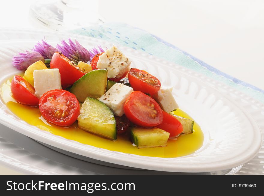 Delicious tomato and cucumber salad with balsamic dressing.
