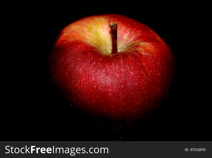 Close-up of Apple Against Black Background
