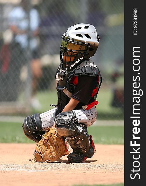 Boy in Black Power Balt Baseball Helmet