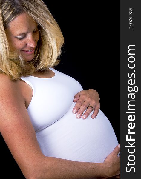 Pregnant woman holding her tummy. Pregnant woman holding her tummy