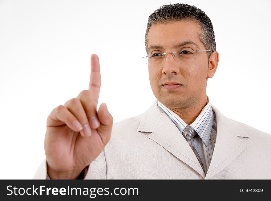 Smiling businessman looking his finger