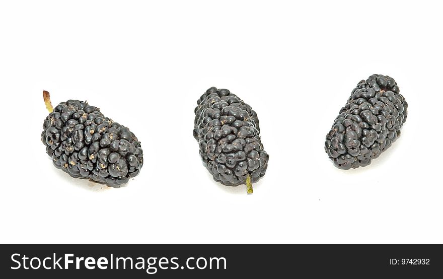 Black mulberries isolated on white background