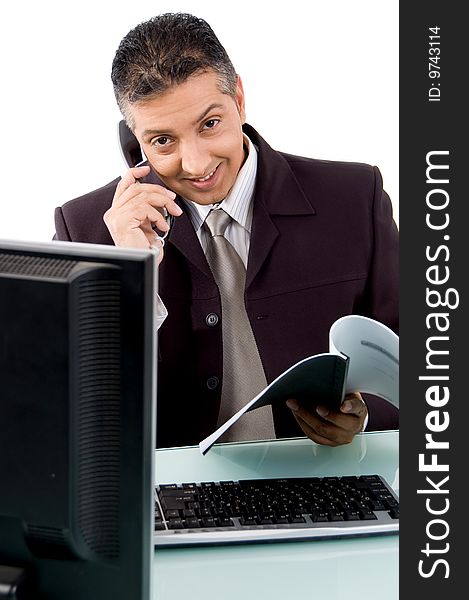 Front view of smiling businessman busy on phone on an isolated white background