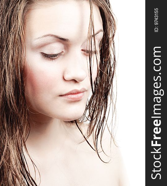 Beautiful girl face with long wet hair