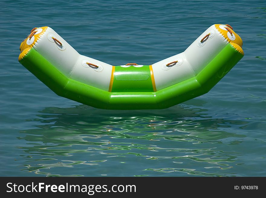 A colorful floating sunbed in the sea