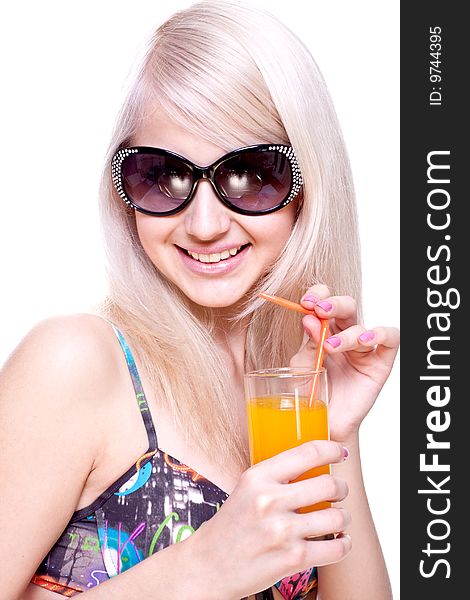 Beautiful women in swimsuit with a glass of juice on a white background isolated