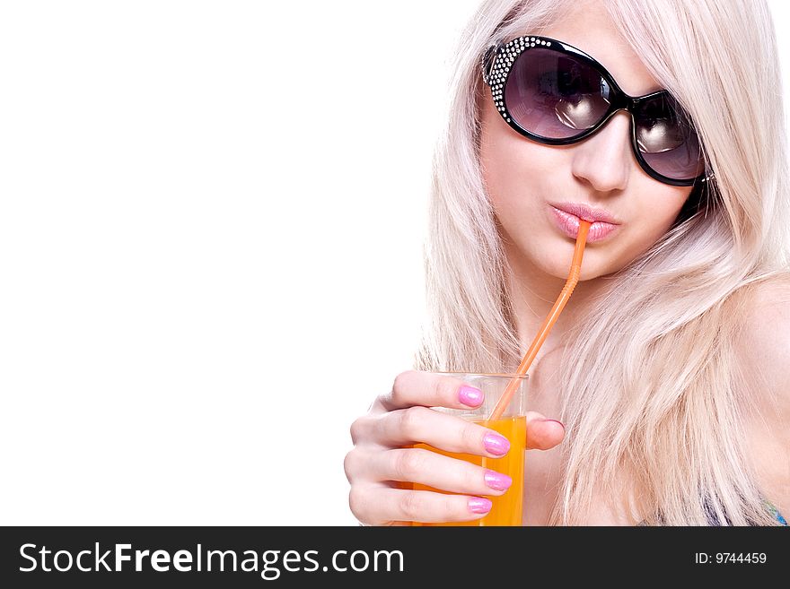 Beautiful women in swimsuit with a glass of juice