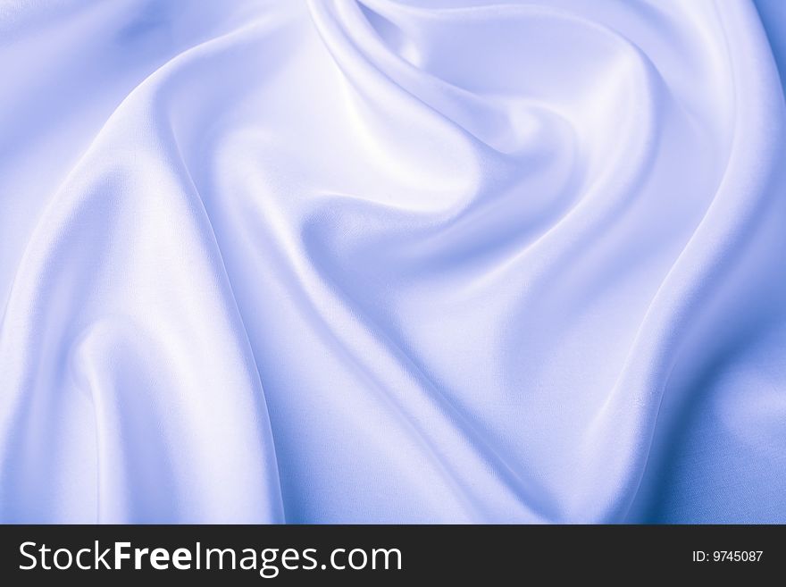 Closeup of abstract blue silk background