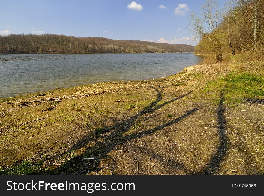 On the shores of the lake in early spring afternoon. On the shores of the lake in early spring afternoon