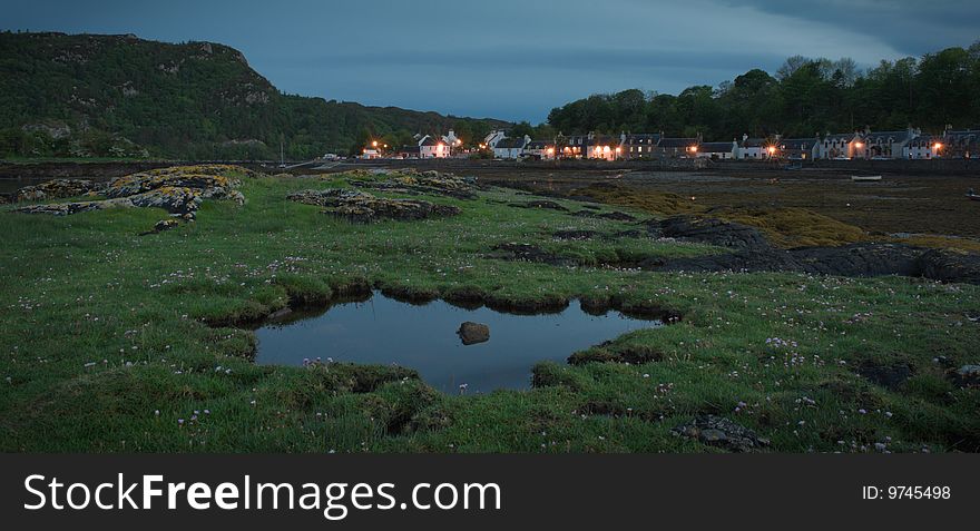 Houses at plockton bay in Scotland at low tide