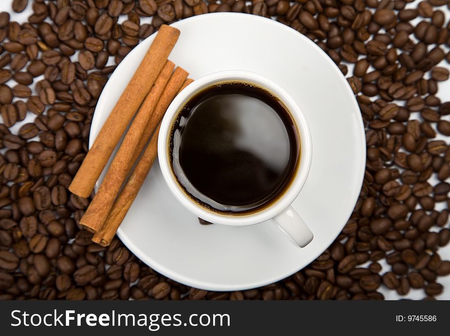 Cup of coffee and coffee beans background