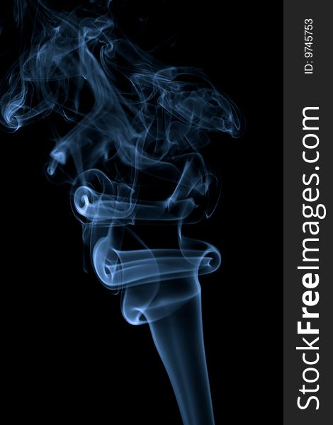 Abstract blue smoke isolated over black