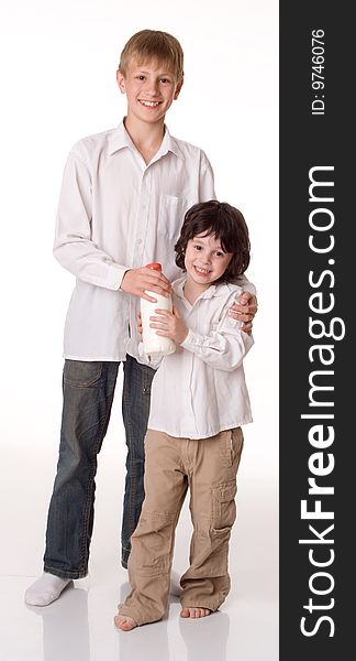 Two brothers with a bottle of milk