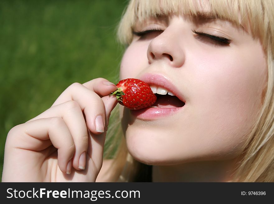 Girl Eating Berry