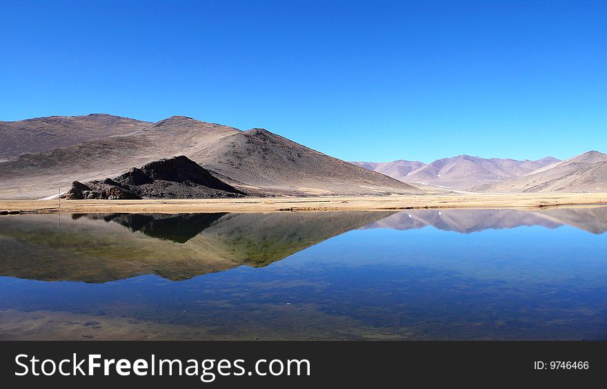 Mirror of a small lake in Tibet. Mirror of a small lake in Tibet