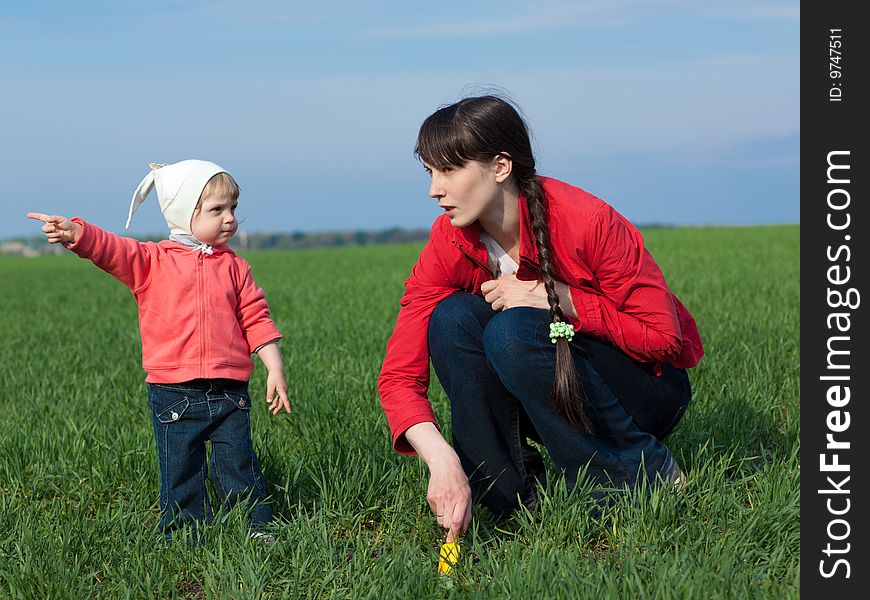 Portrait of a little girl with mom outdoors