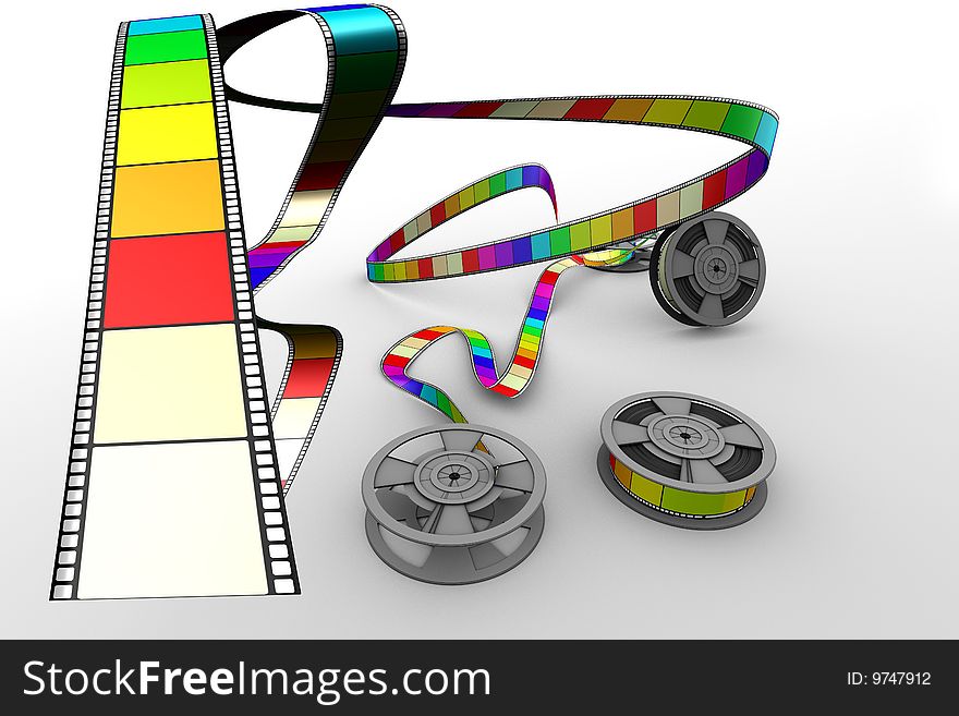 Three Filmreels on white floor shooting out coloured film. Three Filmreels on white floor shooting out coloured film