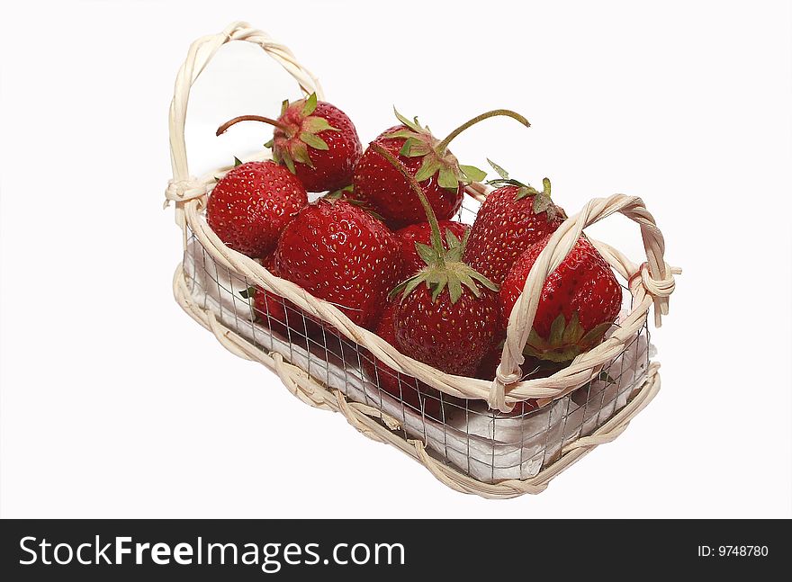 The Strawberries in basket. Photo with using the flash