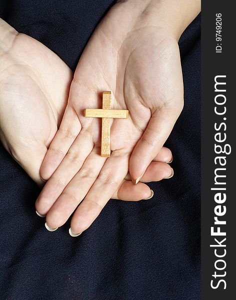 Wooden Cross In Female Hands