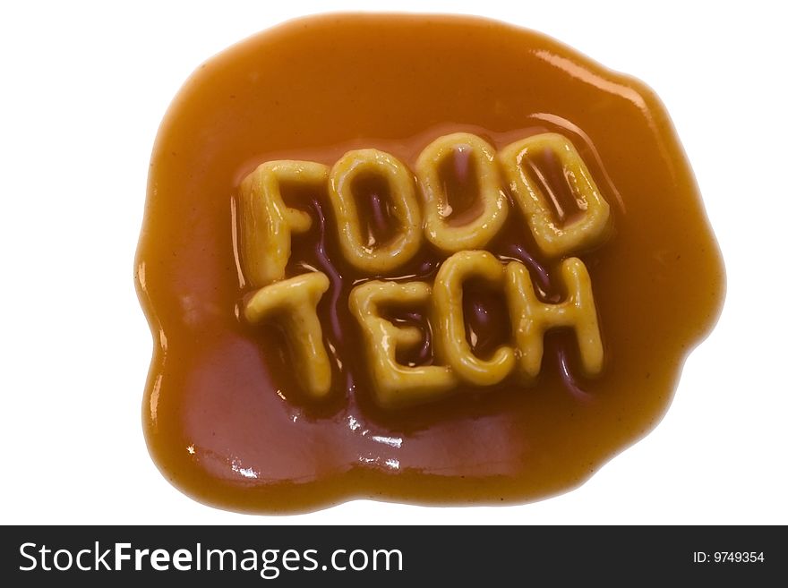 The words food tech spelled out in alphabet spaghetti pasta shapes, with tomato sauce, isolated on a white background. The words food tech spelled out in alphabet spaghetti pasta shapes, with tomato sauce, isolated on a white background.