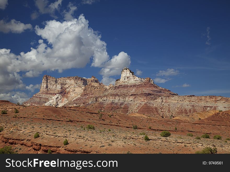 View of red rock formations in San Rafael Swell with blue sky�s the and clouds