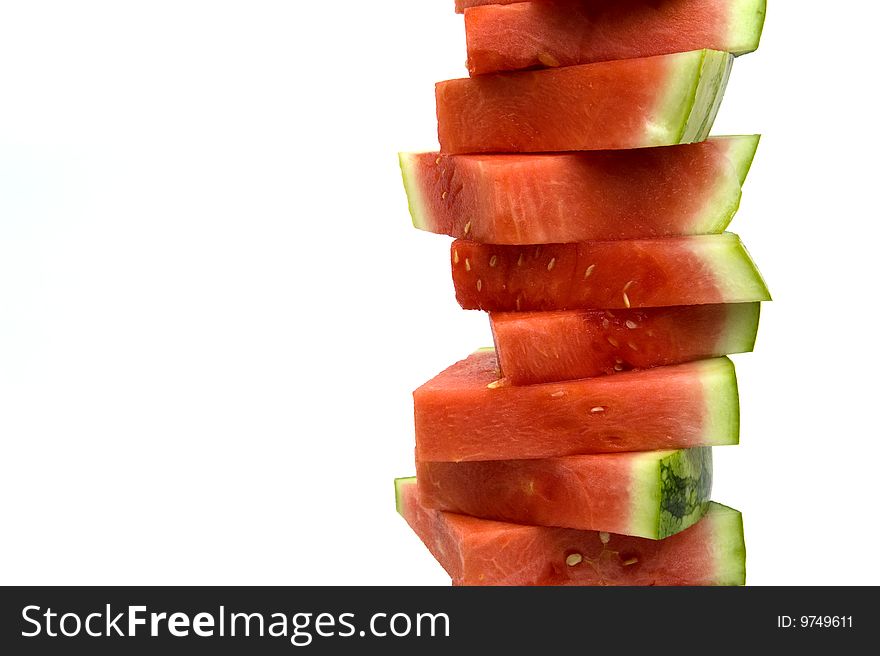 A stack of watermelon slices isolated on white. A stack of watermelon slices isolated on white