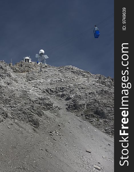 The small cable car that goes from the slopes to the summit of Valluga, high in the Austrian Alps. The small cable car that goes from the slopes to the summit of Valluga, high in the Austrian Alps.