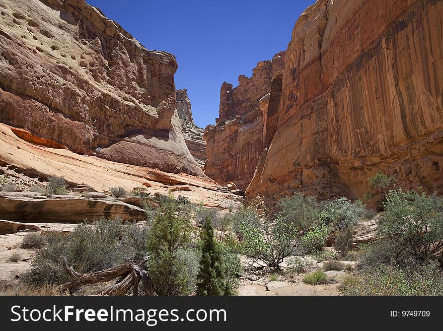 View of red rock formations in San Rafael Swell with blue sky�s the and clouds