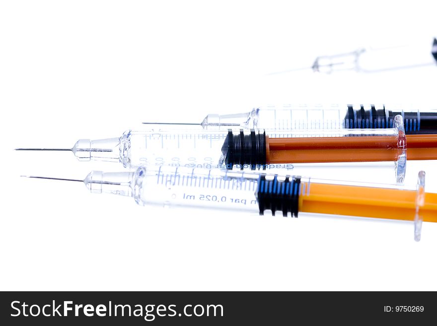 Color syringe on white background