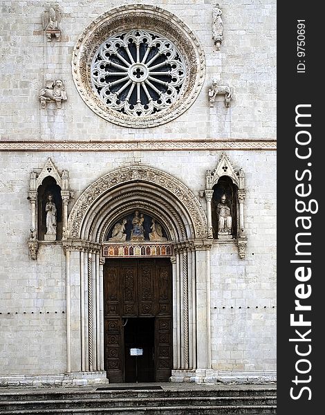 Portal and rose window of the church of St. Benedict (Umbria - Italy). Portal and rose window of the church of St. Benedict (Umbria - Italy)