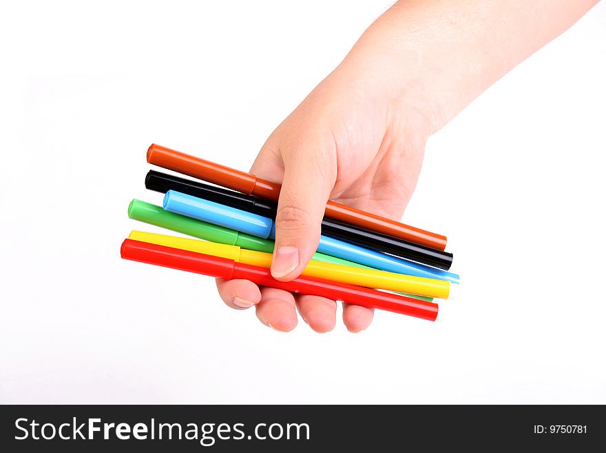 Woman holds colour felt-tip pens in a hand