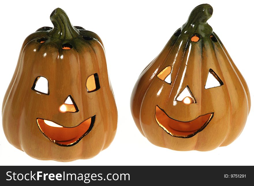 Two ceramic pumpkins with a light candle inside