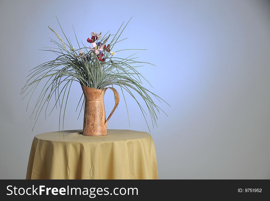 Decorative plant sitting on a glass table