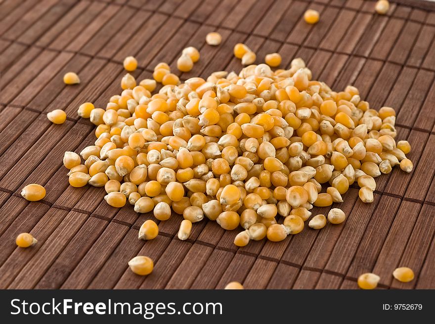 Corn kernels on bamboo mat, close up