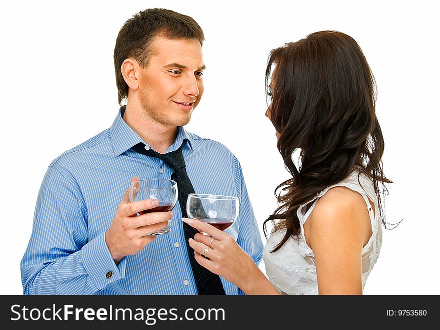 Happy young couple with wine glasses on white. Happy young couple with wine glasses on white