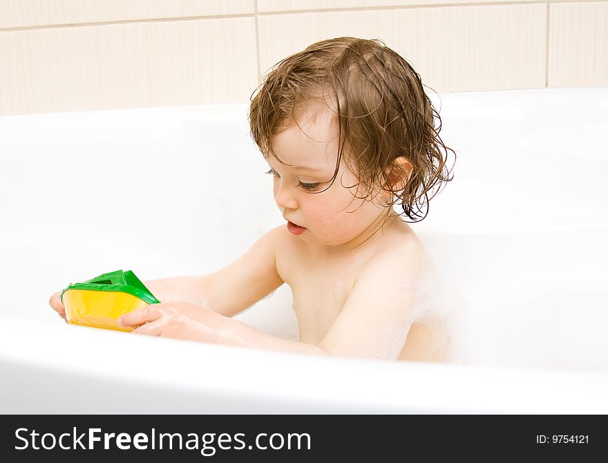 Sweet toddler baby girl in bath