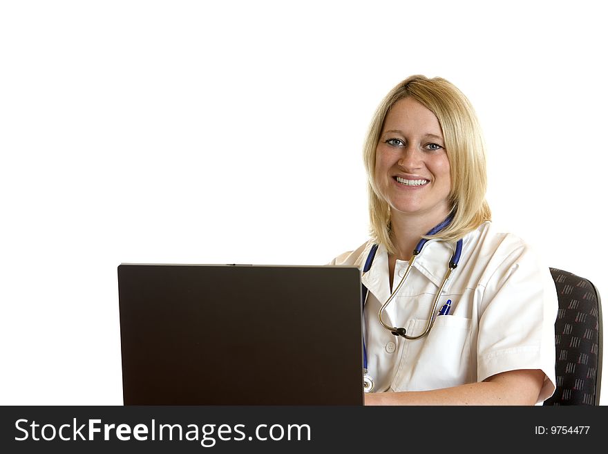 Medical doctor sits on desk and works with computer. Medical doctor sits on desk and works with computer