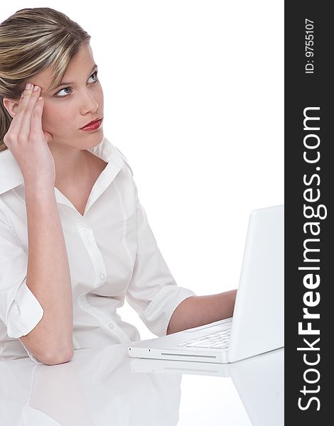 Blond attractive woman working with laptop and thinking on white background